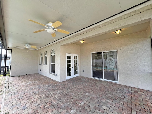 unfurnished sunroom with french doors and ceiling fan