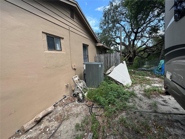 view of side of property featuring cooling unit