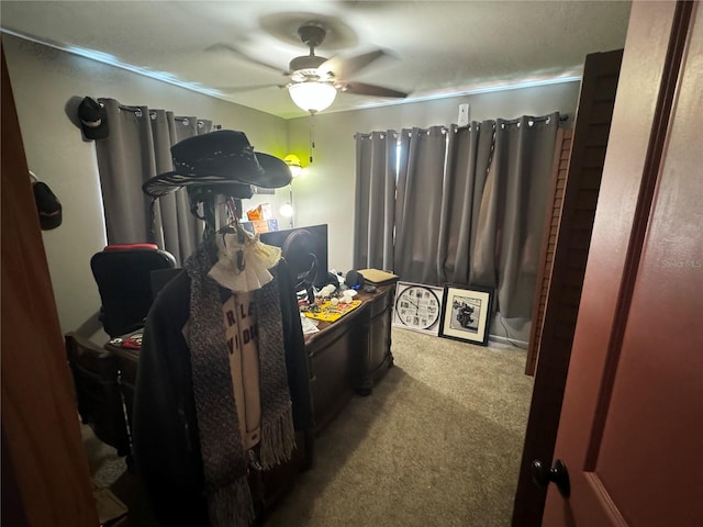 bedroom featuring ceiling fan and light carpet