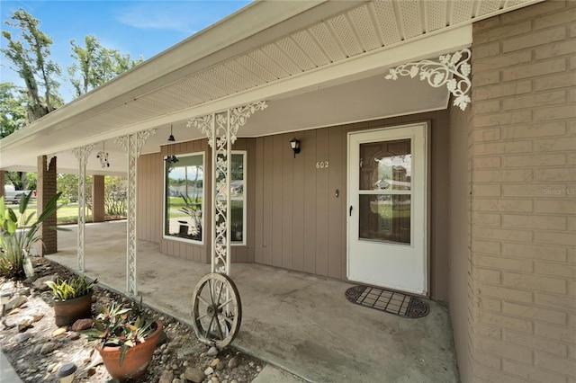 doorway to property featuring a porch