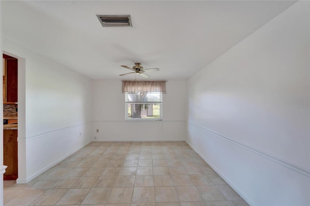 unfurnished room featuring ceiling fan