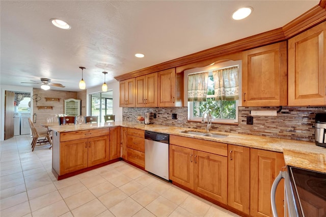 kitchen with sink, hanging light fixtures, stainless steel dishwasher, ceiling fan, and kitchen peninsula