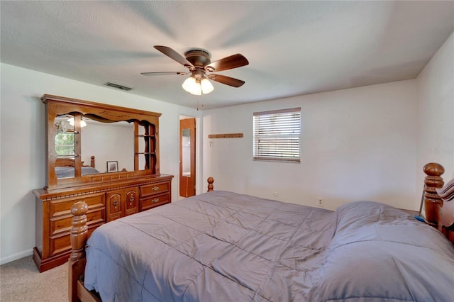 bedroom featuring light colored carpet and ceiling fan