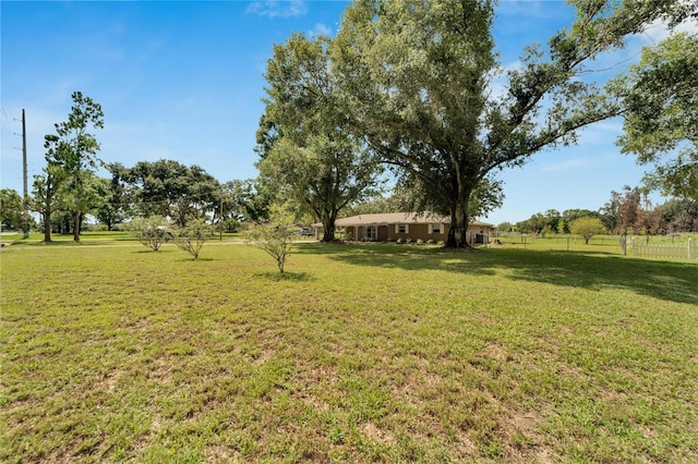 view of yard with a rural view