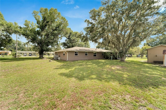 view of yard with a storage shed