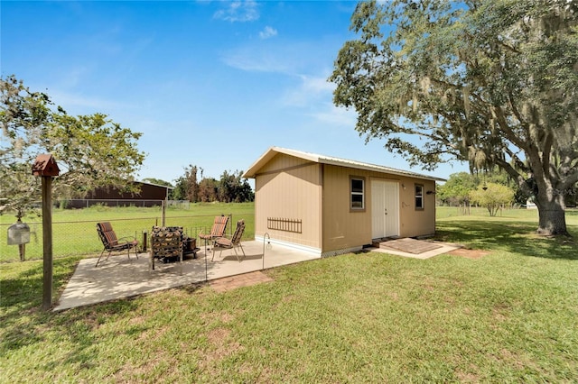 view of outbuilding with a lawn