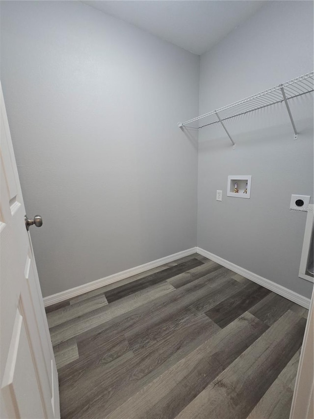 clothes washing area featuring dark hardwood / wood-style flooring, hookup for a washing machine, and electric dryer hookup