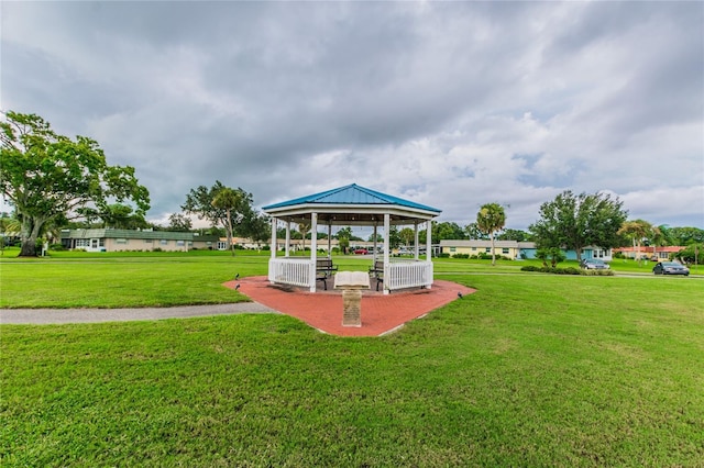 view of property's community featuring a lawn and a gazebo