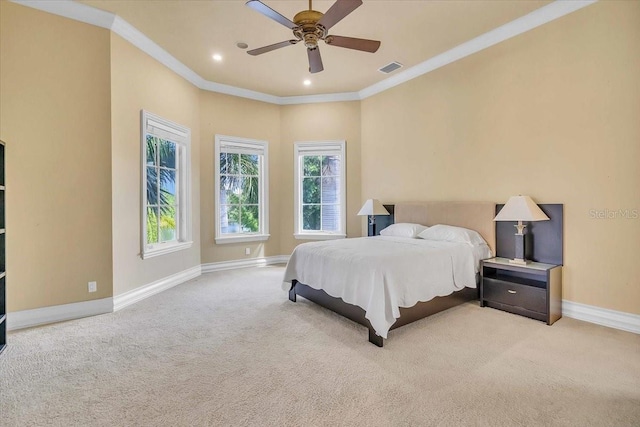 bedroom featuring light carpet, ceiling fan, and crown molding