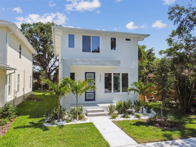 2909 W Spruce St, Tampa, FL 33607 - modern home featuring stucco siding and a front yard