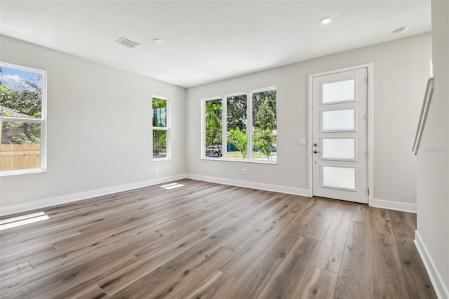 2909 W Spruce St, Tampa, FL 33607 - foyer with wood finished floors and baseboards