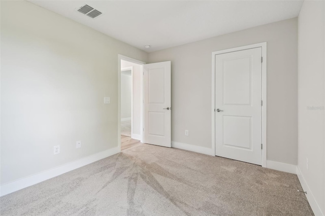 2909 W Spruce St, Tampa, FL 33607 - unfurnished bedroom with carpet flooring and baseboards