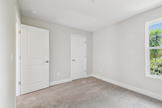 2909 W Spruce St, Tampa, FL 33607 - unfurnished bedroom featuring carpet and baseboards