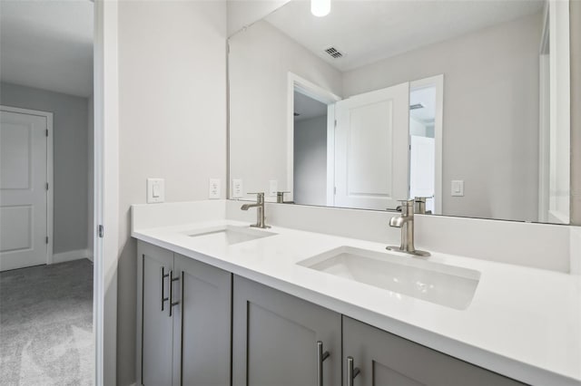 2909 W Spruce St, Tampa, FL 33607 - bathroom featuring double vanity and baseboards