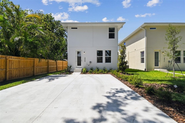 2909 W Spruce St, Tampa, FL 33607 - rear view of house featuring stucco siding