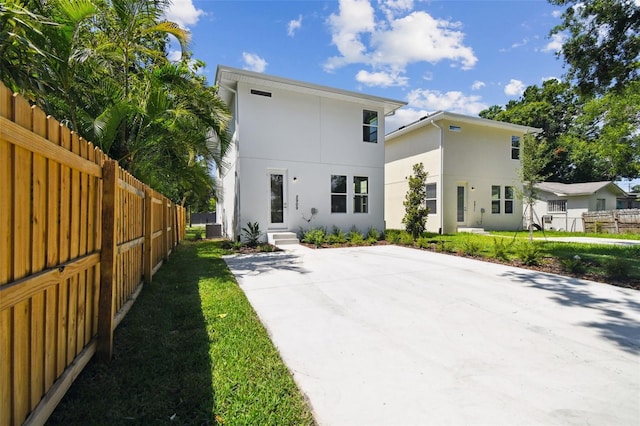 2909 W Spruce St, Tampa, FL 33607 - rear view of house featuring stucco siding