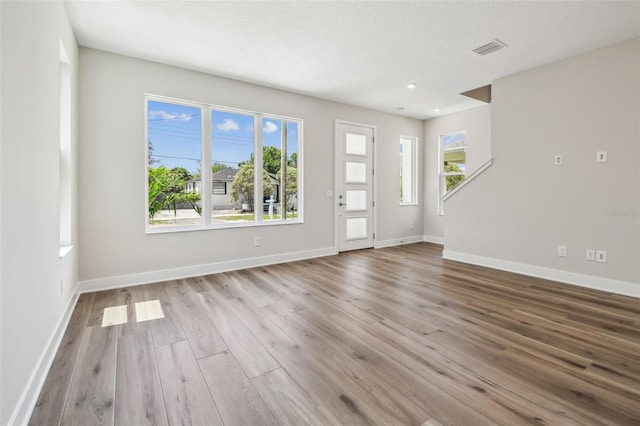 2909 W Spruce St, Tampa, FL 33607 - entrance foyer featuring wood finished floors and healthy amount of natural light