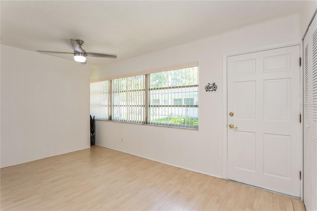 spare room featuring ceiling fan and light wood-style floors