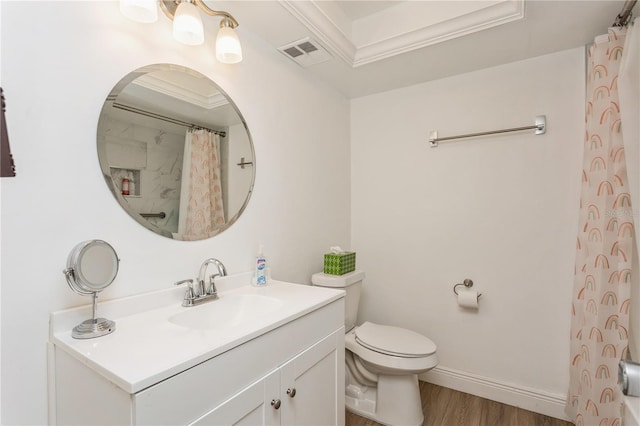 bathroom with toilet, wood finished floors, vanity, visible vents, and baseboards