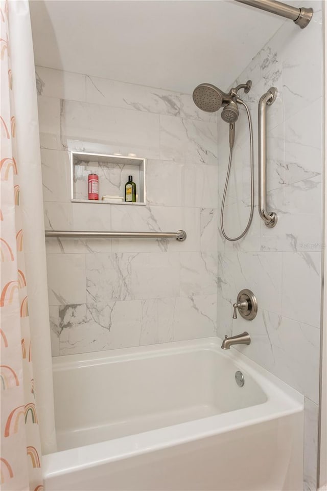 bathroom featuring shower / bathtub combination with curtain