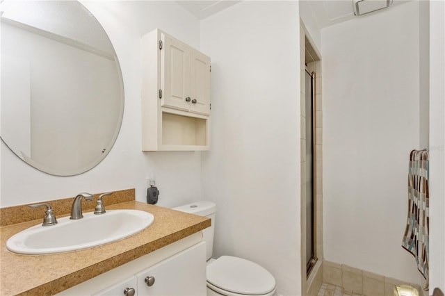 full bathroom with toilet, a stall shower, and vanity