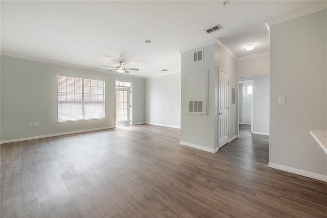 empty room with a textured ceiling, dark hardwood / wood-style floors, ceiling fan, and ornamental molding