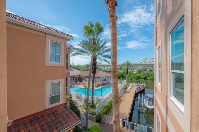 view of pool featuring a water view