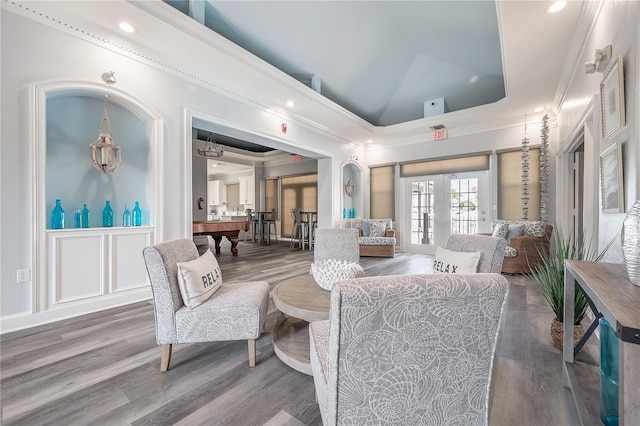 living room featuring hardwood / wood-style floors, pool table, high vaulted ceiling, and french doors