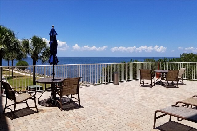 view of patio with a water view