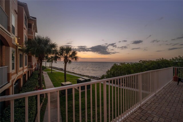 balcony at dusk with a water view