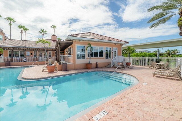 view of swimming pool featuring a patio area