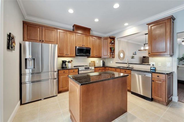 kitchen with a center island, sink, appliances with stainless steel finishes, light tile patterned floors, and dark stone counters