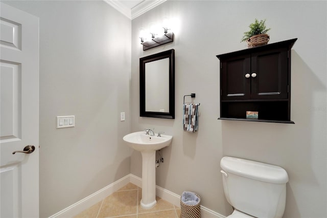 bathroom with toilet, tile patterned floors, and ornamental molding