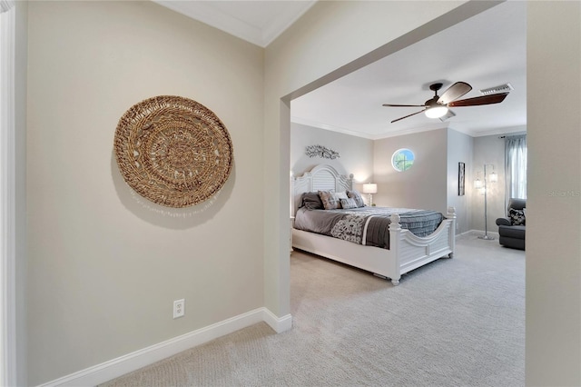 bedroom featuring ceiling fan, ornamental molding, and carpet flooring