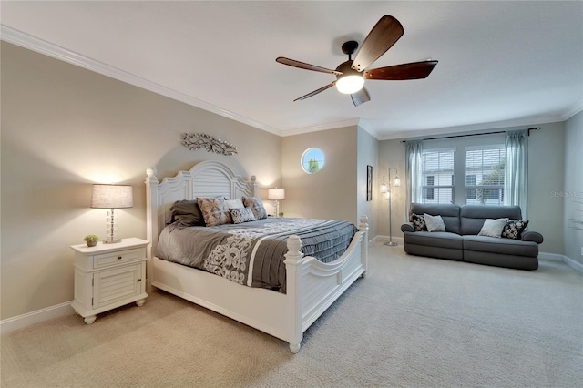 carpeted bedroom with ceiling fan and crown molding