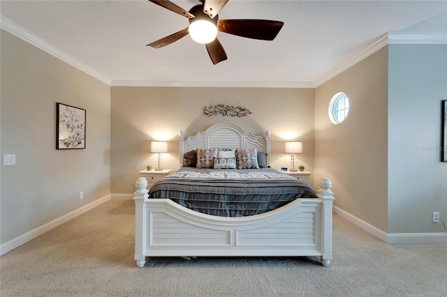 carpeted bedroom featuring ceiling fan and ornamental molding