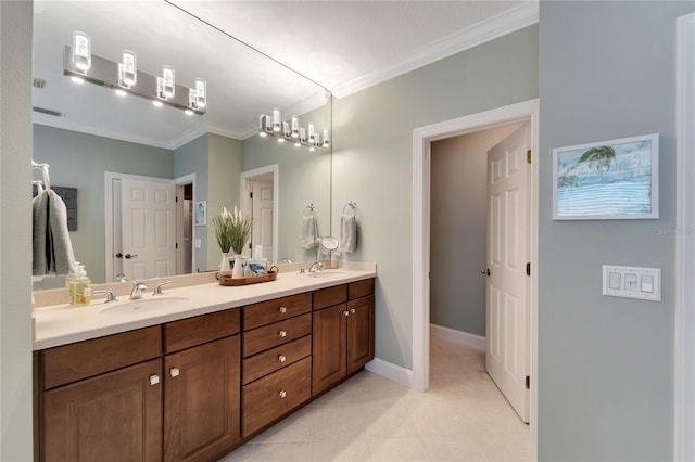 bathroom with crown molding, tile patterned floors, and vanity