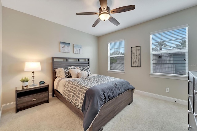 bedroom featuring ceiling fan and light colored carpet