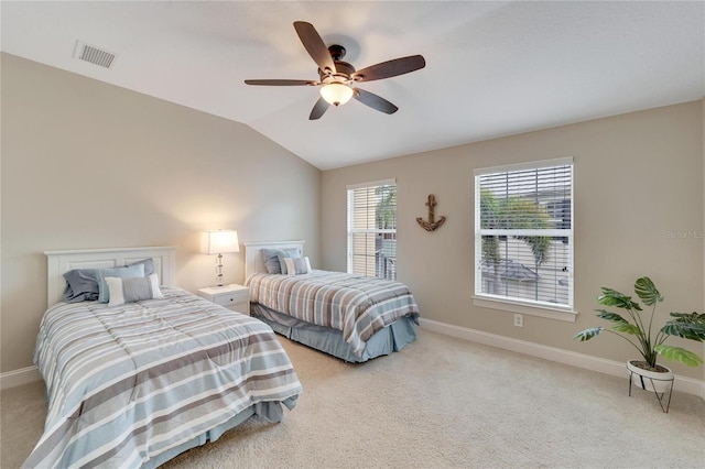 carpeted bedroom with ceiling fan and lofted ceiling