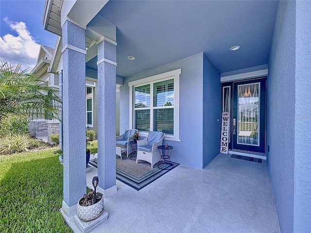 property entrance featuring covered porch