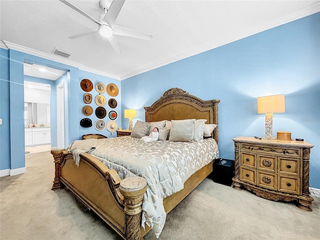 carpeted bedroom featuring ceiling fan and ornamental molding