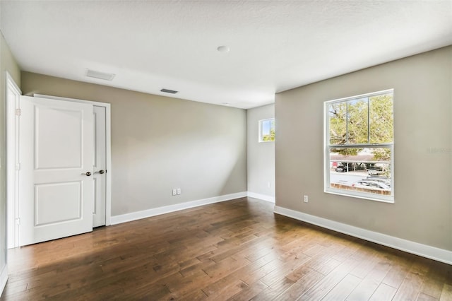 empty room featuring hardwood / wood-style floors