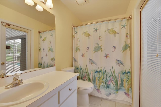 bathroom with a shower with shower curtain, tile patterned flooring, vanity, and toilet