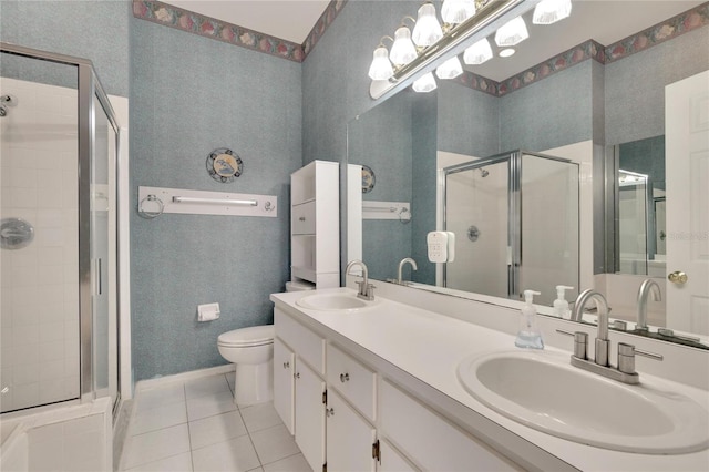 bathroom with walk in shower, vanity, toilet, and tile patterned floors