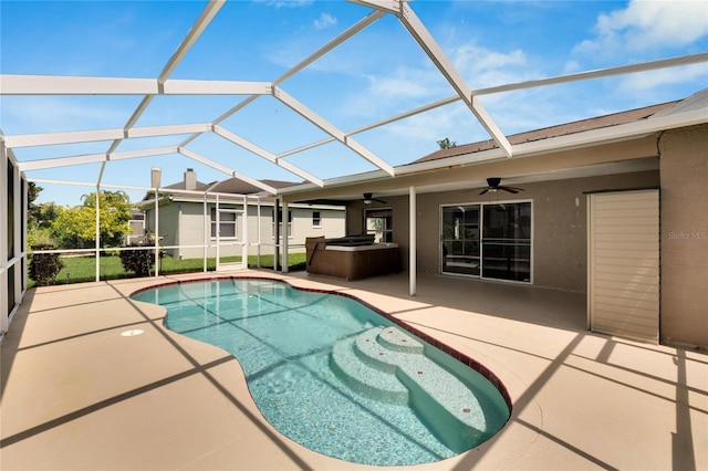 view of pool featuring ceiling fan, glass enclosure, and a patio