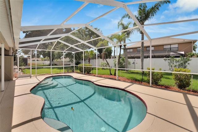 view of swimming pool with a yard, a lanai, and a patio area