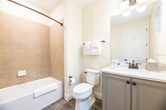 full bathroom with vanity, toilet, and tiled shower / bath