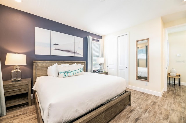 bedroom with a closet and light wood-type flooring