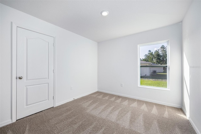 empty room with carpet flooring