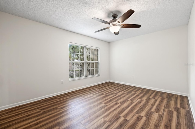 spare room featuring a textured ceiling, dark hardwood / wood-style flooring, and ceiling fan